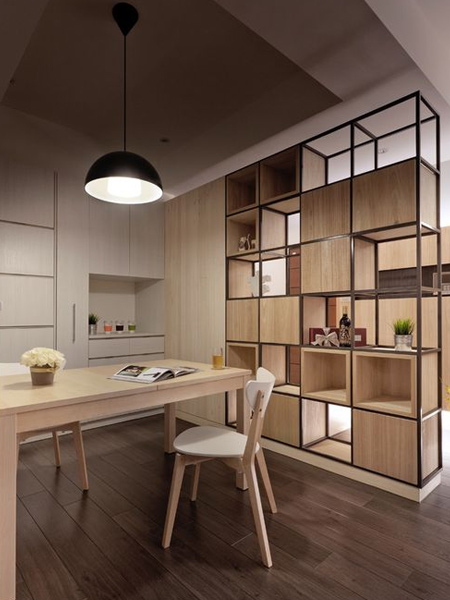 In an open plan space that is short on floor space, it's always practical to look a pieces that serve more than one function. A room divider, for example, can also serve as decorative shelving, or with one side closed off for practical storage.