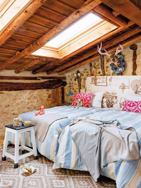 Two bedrooms in the guest cottage are located within the roof space on a raised platform. Additional lighting is provided by the addition of skylights.