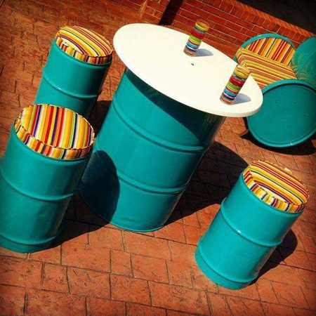Use recycled oil barrels to create a bistro-style outdoor dining or entertaining area that is durable and won't break the bank. 