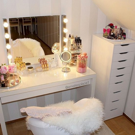 Proper lighting is essential for any vanity. An easy way to make your own lighting strips is to drill holes through a board and push through LED string lights. Pop on some transparent Christmas baubles to finish off.&nbsp;