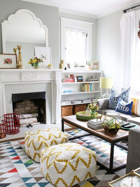 Create a bold display by painting the back of a bookshelf in a bold colour, or glue wallpaper or wrapping paper on the back for an interesting focal piece.
