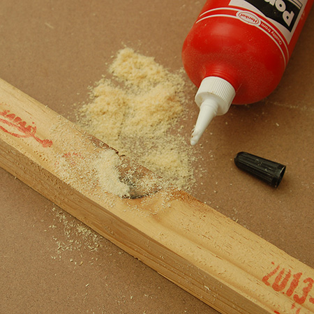 Where you need to fix and disguise knots in pine, first apply a thin bead of wood glue into any gaps. Let this settle into the hole for about an hour and then apply more wood glue to fill up gaps - topping this off with pine sawdust and pressing down.