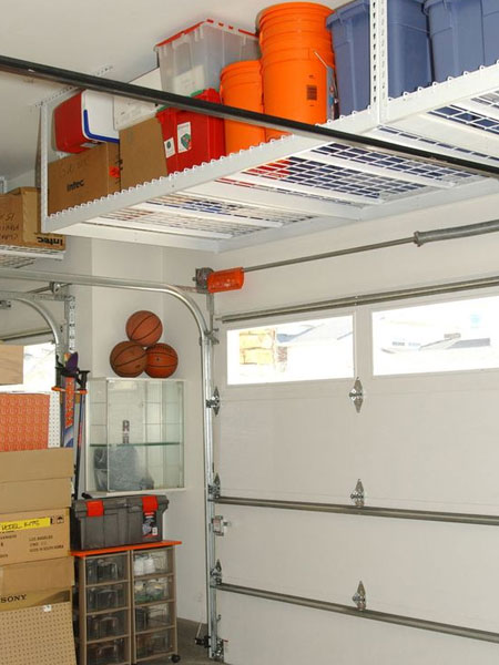 Bins and buckets are an easy way to store smaller items, but what do you do with all the bins and buckets? That's easy... build shelving along a wall, or use any available space up high to store items that are not in regular use. In most garages with a high ceiling, the space above a garage door is valuable room that can be put to good use.&nbsp;
