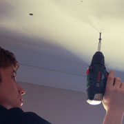 Fix ceiling board to battens