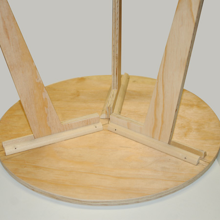 BELOW: Fitting the legs into the slots underneath the table.