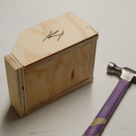 3. Hammer in a couple of panel pins along each edge.