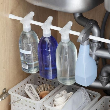 The cupboard under a sink can quickly become a disaster zone if this is where you store all your cleaning products. An easy and inexpensive solution to organise under sink is to mount a tension rod, or pine dowel on hanger brackets, and use this to organise all your cleaning products.