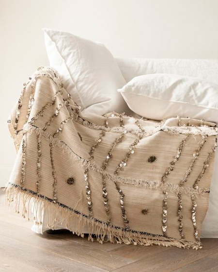 A Moroccan wedding blanket adds a dash of sparkle to a bedroom. With sequins and tassles, here's an easy way to update or up the romance in your bedroom.