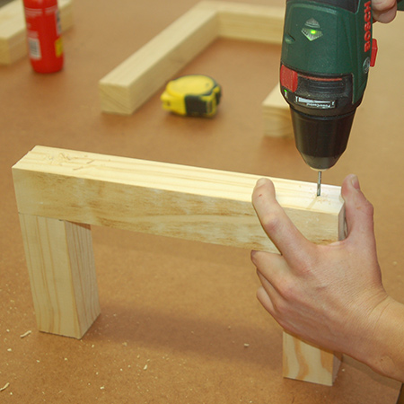 2. To assemble the small step stool, drill 3mm countersunk pilot holes through the side rail into the legs. Join with wood glue and [60mm] screws. 