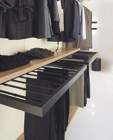To make the most possible use in a small space, incorporate storage that frees up available space. For example, a pull-out trouser rack can be mounted on the lower level for easy access.