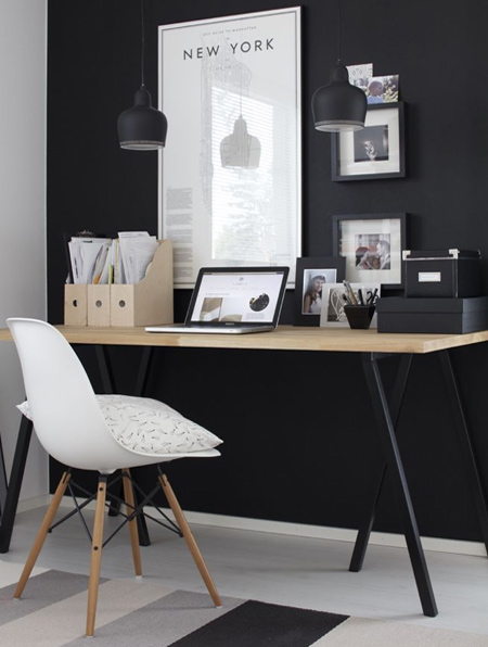 Transform a boring wall into a feature wall with a few coats of pure black paint. When you layer with white, the wall instantly stands out.