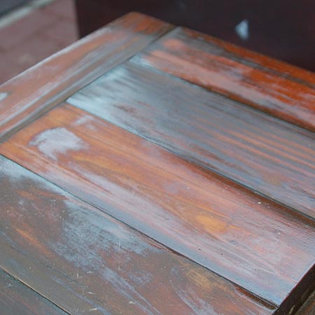 First coat, showing areas where the product has quickly been absorbed into dry wood.