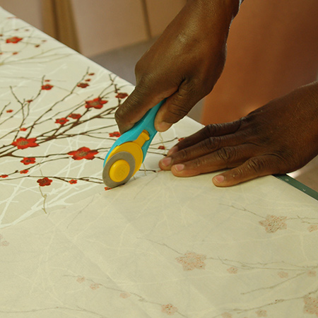 Olfa Cutters are amazing! When fabric is placed on top of a self-healing mat it's easy to cut straight lines and circles. Find a selection of Ofla Cutters and Knives at Builders and hardware stores.
