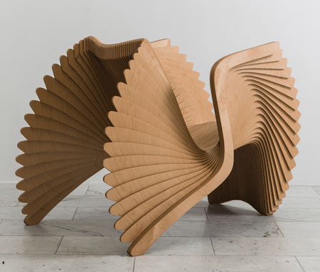 HOME-DZINE | Iconic Design - The challenge was to create a single flat shape containing the four main elements of an armchair. The back leg gradually morphs into the backrest into the armrest and then into the front leg.