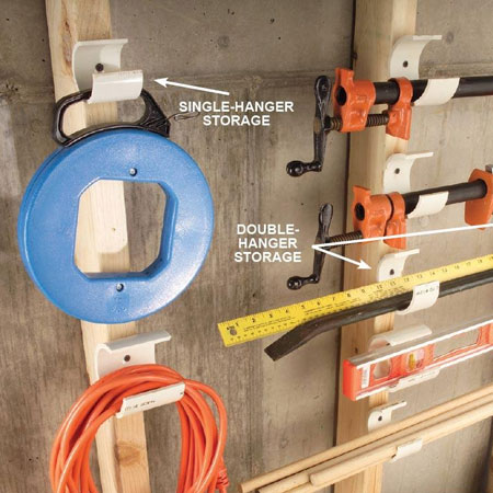 HOME-DZINE | Workshop Organisation - And yet another PVC pipe storage idea for the workshop... cut away a section of the pipe to create hangers that can be mounted on pine planks. Use the hangers to organise large items with hangers, cords, long dowels and clamps, etc.