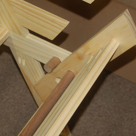 HOME-DZINE | DIY Projects - Futon in upright position with dowel inserted to support arm sides.