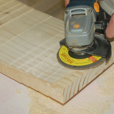 A flap disc makes it easy to remove excess wood. 
