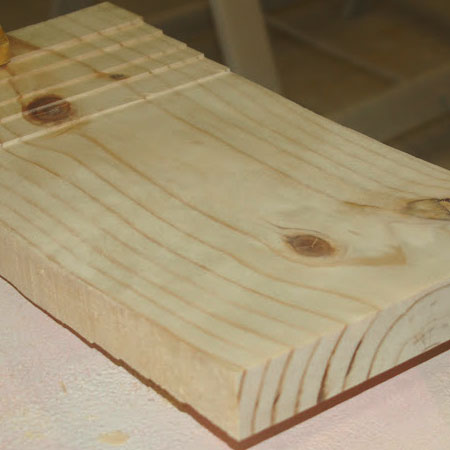 Half the curved seat after sanding with a flap disc.