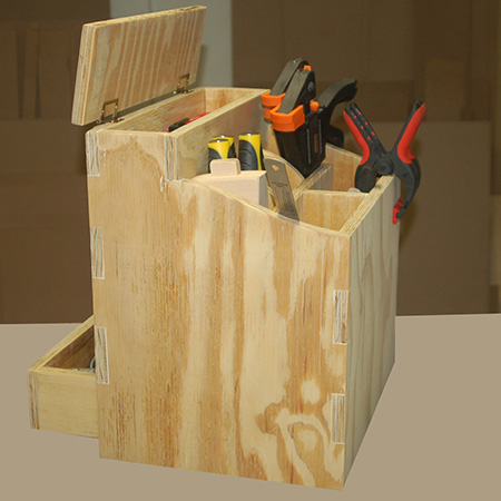 HOME-DZINE | DIY Projects - The tool caddy has large storage compartments in the main section for larger tools, it has a small compartment with a lid for pencils, tape measure and other smaller items, and there is a pullout drawer at the back of the caddy.