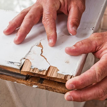 3. Apply exterior-grade wood glue to the damaged area and press the broken piece back in place.