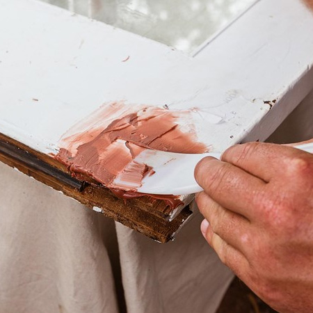 5. Use exterior-grade filler (for timber) to fill gaps between the patched pieces. Larger gaps can be filled with Alcolin QuikWood. Only apply enough filler to cover the damage area, and avoid the area where the roller assembly will be re-fitted. Leave to dry for the specified amount of time.