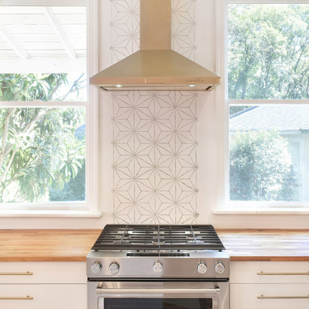 Shibori Japanese Wall Stencil was used to create a simple black and white backsplash.