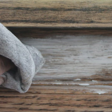 You can't apply liming wax over a sealed or varnished table