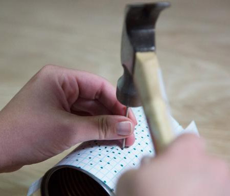 use a hammer and thin nail to dent the can