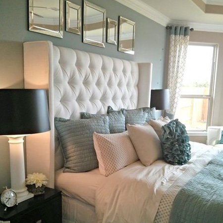 add upholstered headboard to insulate bedroom