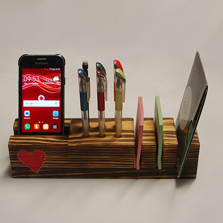 This pine desk organiser is easy to make using a few pine offcuts, and you don't need any tools other than a mitre saw (or jigsaw or table saw). Because Valentine's Day is close, I added a heart design using a Sharpie paint pen, to give it a romantic touch!