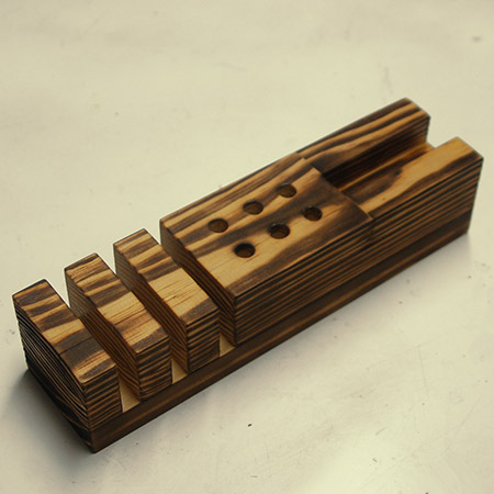 8. Sand down with 240-grit sandpaper to remove any scorched wood on the surface.