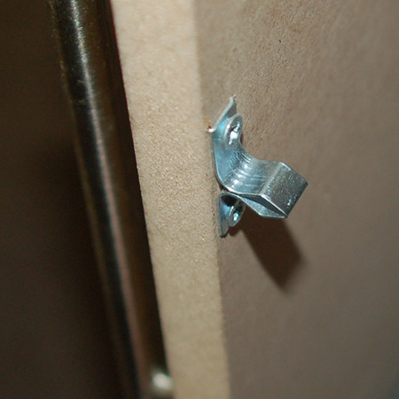  It's a good idea to drill a small 2mm pilot hole to make it easier to secure the catch with screws.