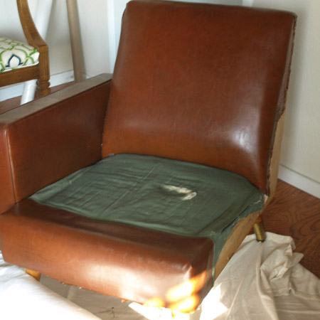1. The first step was to disassemble the chair. To do this, tip the chair upside down and remove any fabric on the base to gain access to the inside workings. This is where you will see the fastenings that secure the various sections of the chair together.