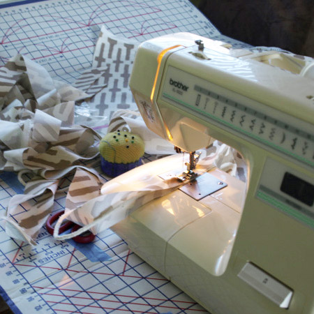 5. Use the vinyl removed to cut new fabric to upholster the chair sections. On this particular chair welting was added to the arms, back and seat cushion.