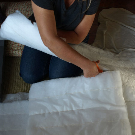 6. A piece of high-density foam was bought to replace the missing seat cushion, and this was covered with a thin layer of batting. You can also add batting to areas on the chair where the padding has failed.