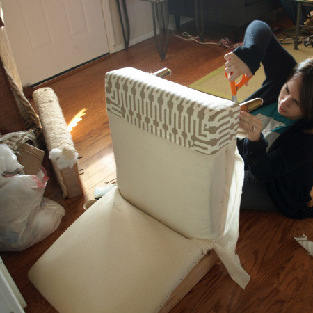 7. Before re-assembly the chair, wrap and staple fabric onto the seat base and back. After that you can start to re-assemble the chair with the individual pieces now covered in a new fabric.