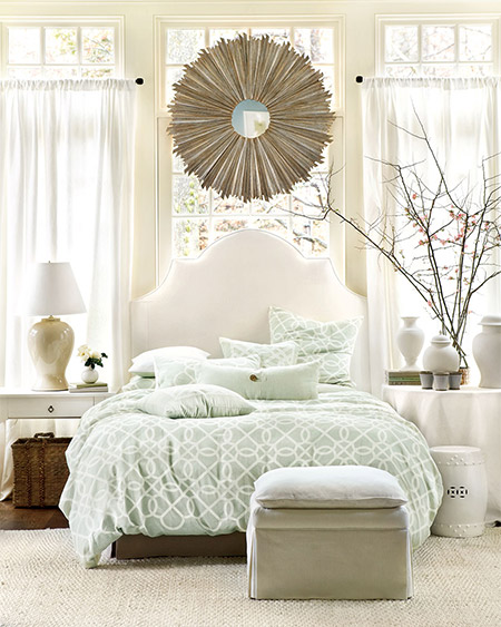 When designing your home or moving into a new home, bedrooms don't always have room to be fussy about where to put the bed. Sometimes placing the bed in front of a window works perfectly!