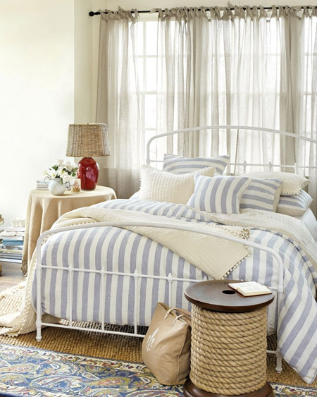 In a bedroom that doesn't get a lot of natural light, keep the headboard open and airy, like these steel frame beds.