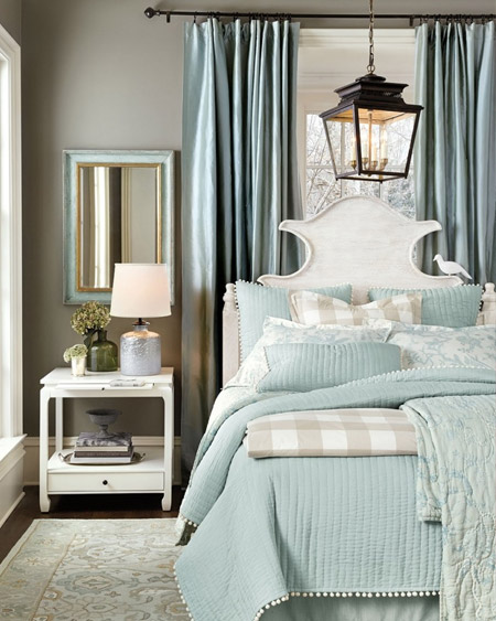 If your bedroom receives too much sunlight and tends to be on the warm side during the summer months, choose a headboard that has height and structure and will make a big statement against the window.