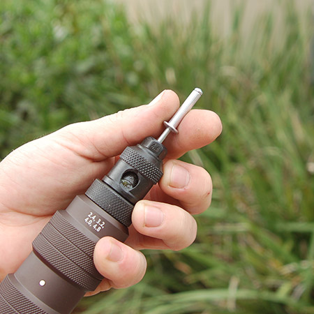 Insert the Tork Craft Drill Pop Riveter into your drill chuck and tighten and then insert a pop riveter.