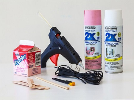 HOME-DZINE | Craft Ideas - These cute, colourful bird feeders can be hung up around the garden to attract birds. They're made from old yoghurt containers and a few additional items.