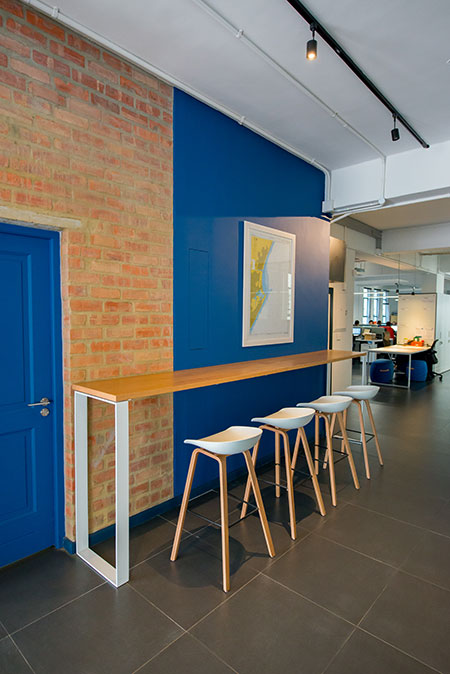 HOME-DZINE | Interior Design - Allport offices - The remainder of the 2nd floor office space is dominated by white walls that are softened by the inclusion of bare brickwork, polished parquet flooring, sections of grey tiling and various shades of blue. Nautical maps are scattered throughout, paying homage to the industry in which the firm operates.