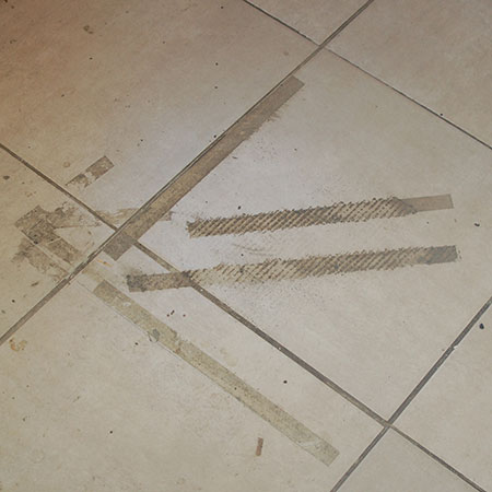 remove sticky tape from tiles
