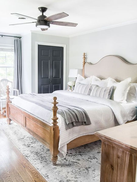 cover a dark wood headboard with light fabric