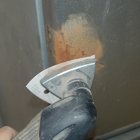 restore refrigerator with Rust-Oleum Appliance Epoxy spray paint - sanding rust
