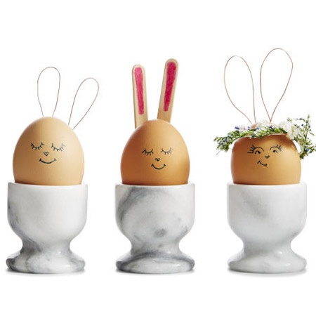 These bunny Easter eggs will be a feature on a kid's table. Use small pieces of wire or ice-cream sticks glued onto the back of the eggs.