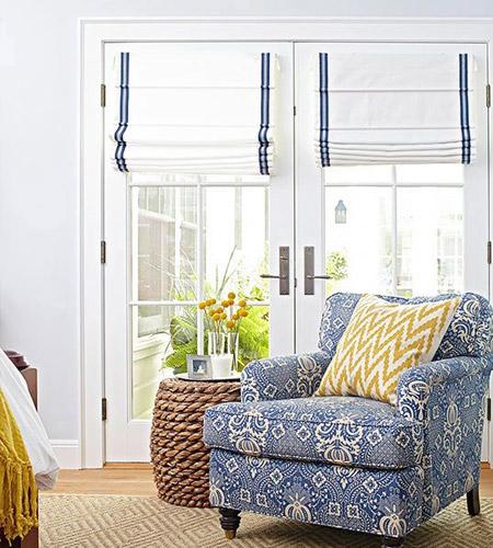 If you're not a fan of flounces and frills, you can't go wrong with simple Roman blinds as a window dressing for French doors. 