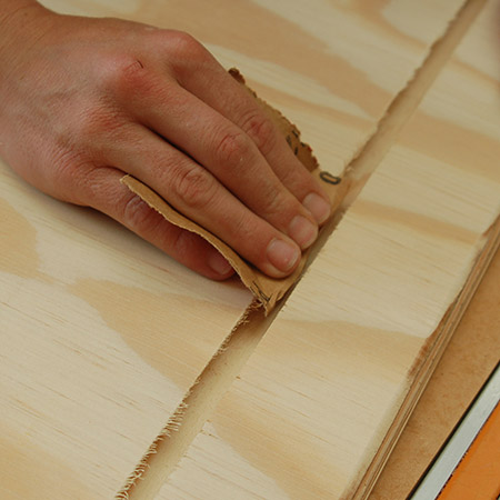 Sand away any rough edges after routing out the slot.