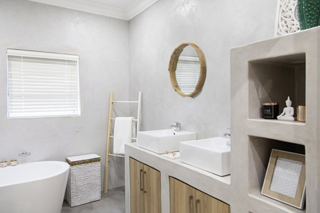 For the bathrooms Roxy selected CreteCote in Nickel Grey for the floors and a Pewter SatinCrete for the walls.