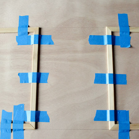 Apply adhesive to the backs of the moulding strips